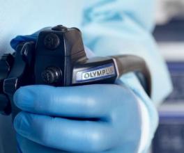 Hand on dial of scope