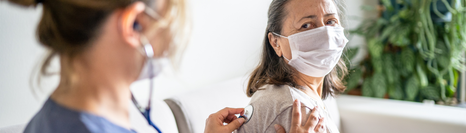 Physician checking patient's lungs