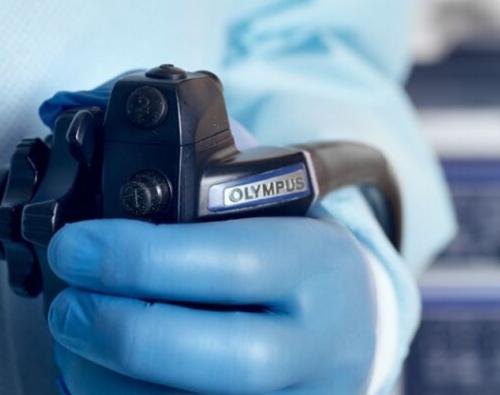 Hand on dial of scope